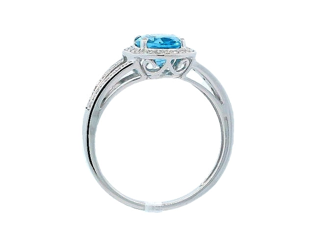 Lady's Split Shank Oval Blue Topaz and Diamond Ring.